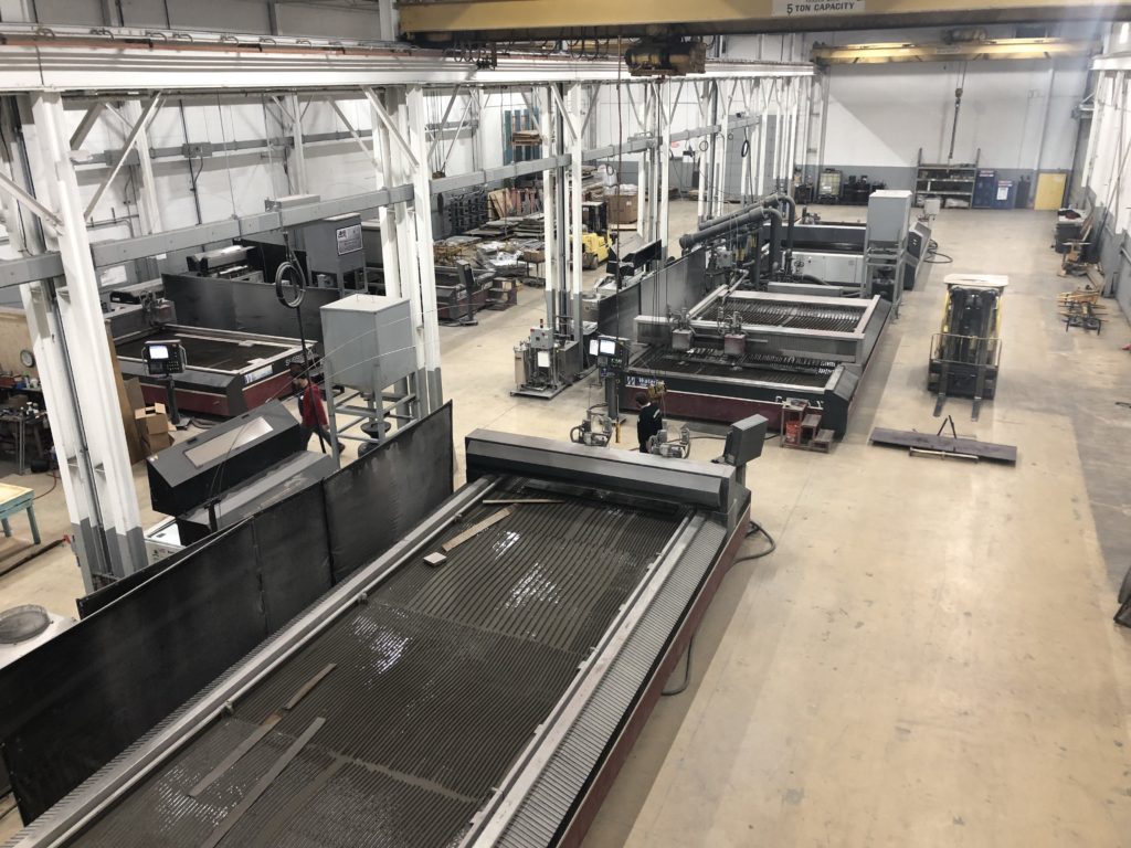 Fenixx Technologies shop floor showing multiple waterjet cutting systems